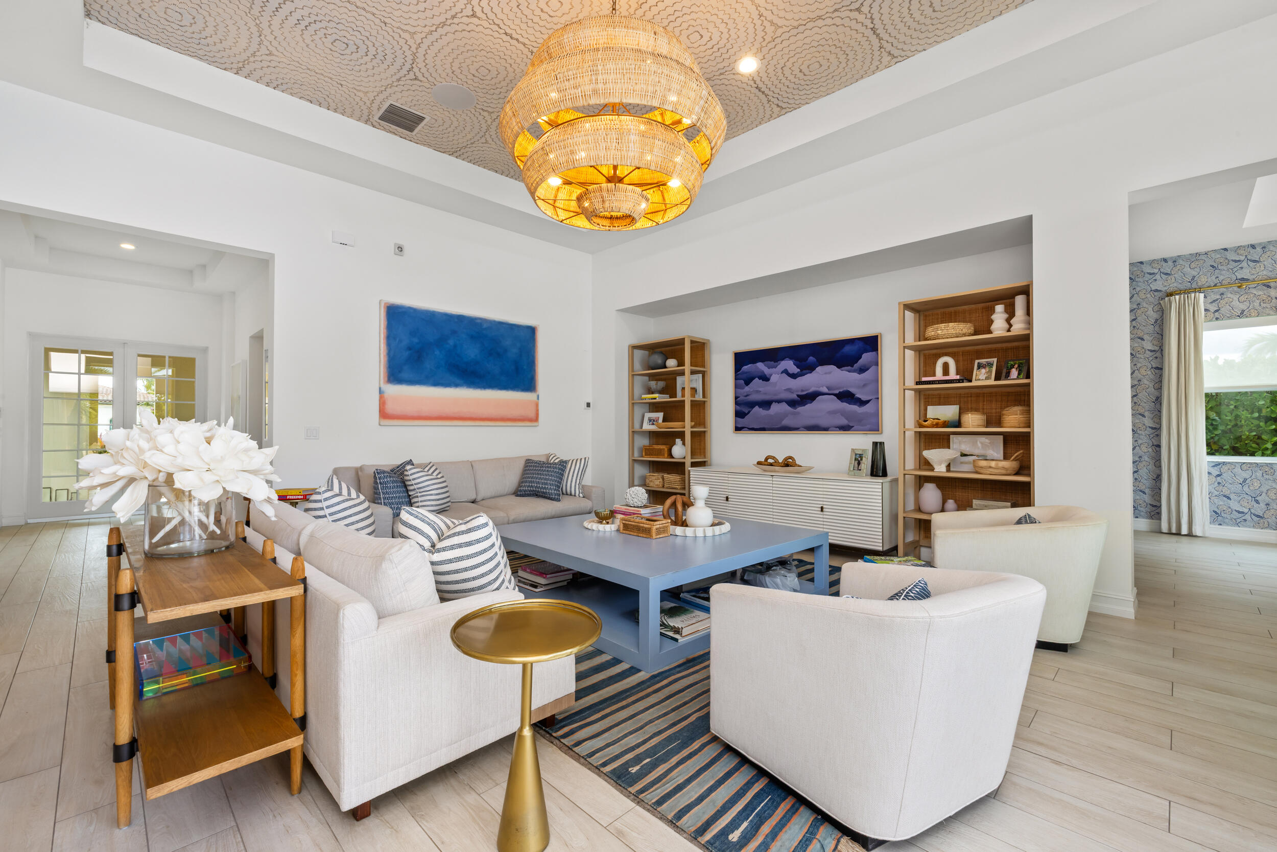 8001 Southeast Plantation Circle Jupiter, FL 33458 - Photo 9 of 50 a living room with furniture a chandelier and a large mirror