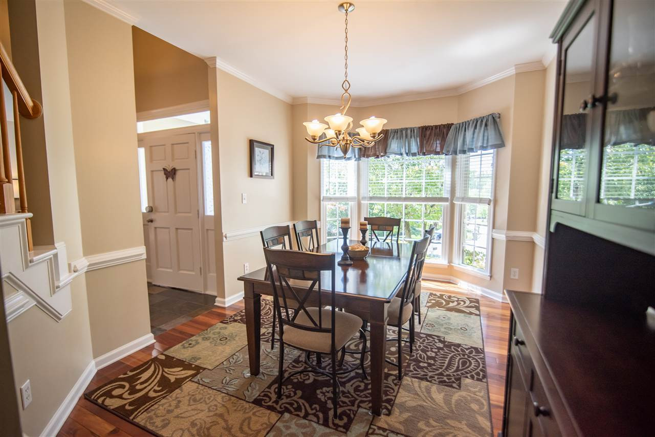 9720 Talman Court Raleigh, NC 27615 - Photo 8 of 30 Large bay window lets the light shine on the gorgeous Brazilian Koa exotic hardwood floors. Dining Room