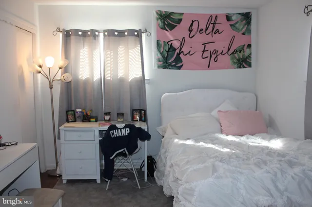 a bathroom with a bathtub and a mirror