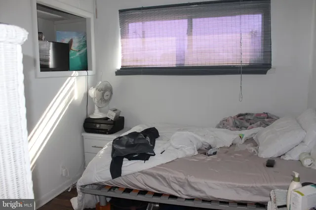 a bedroom with a bed and furniture