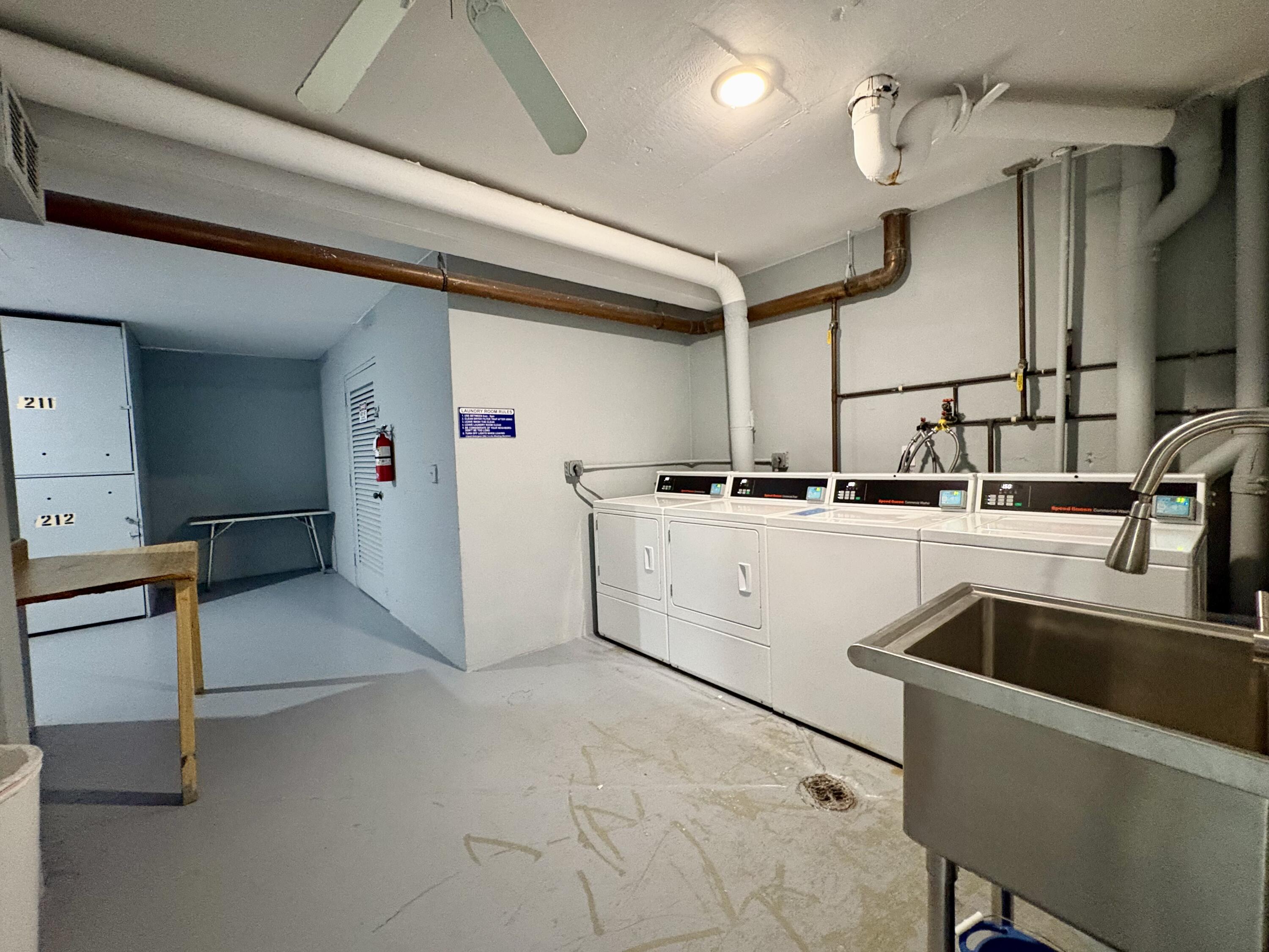 5700 Northwest 2nd Avenue, Unit 203 Boca Raton, FL 33487 - Photo 22 of 29 LAUNDRY ROOM AND STORAGE