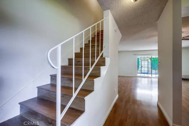 a view of entryway with wooden floor