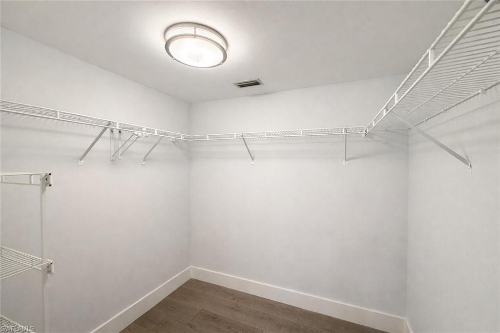 534 Augusta Boulevard, Unit E104 Naples, FL 34113 - Photo 12 of 26 a view of a room with racks on the wall