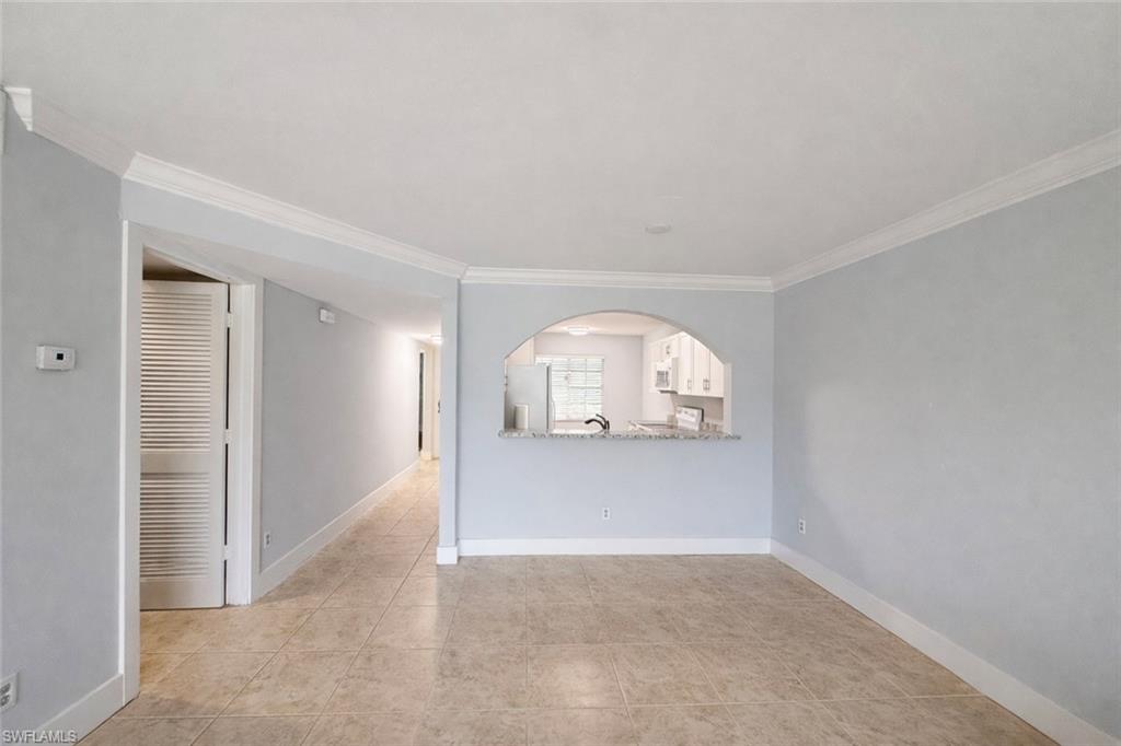 534 Augusta Boulevard, Unit E104 Naples, FL 34113 - Photo 14 of 26 an empty room with a space