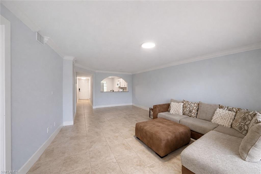 534 Augusta Boulevard, Unit E104 Naples, FL 34113 - Photo 18 of 26 a living room with furniture