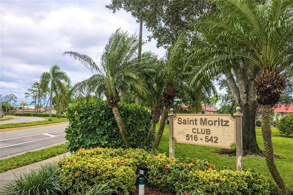534 Augusta Boulevard, Unit E104 Naples, FL 34113 - Photo 25 of 26 a sign on the side of the road