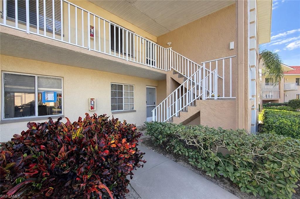 534 Augusta Boulevard, Unit E104 Naples, FL 34113 - Photo 4 of 26 front view of a house