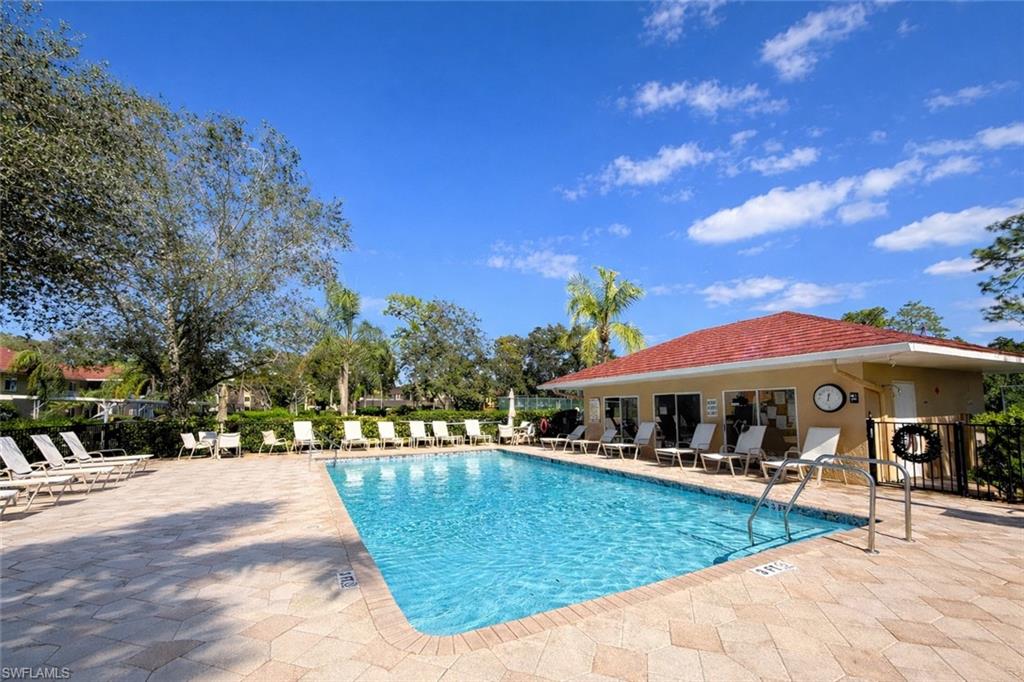 534 Augusta Boulevard, Unit E104 Naples, FL 34113 - Photo 6 of 26 a view of a house with swimming pool and sitting area