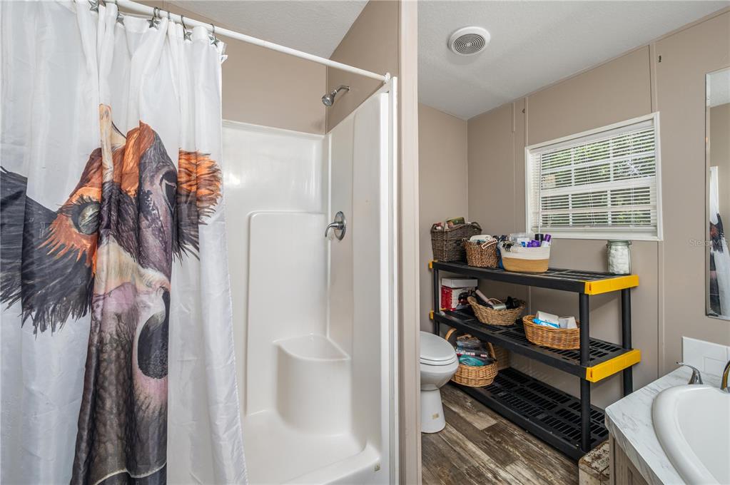 15079 Brahma Road Polk City, FL 33868 - Photo 11 of 40 a room that has a bed and a desk in it