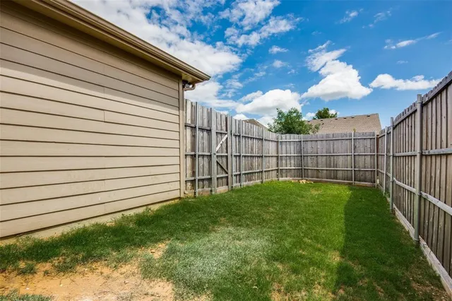 a view of backyard with green space