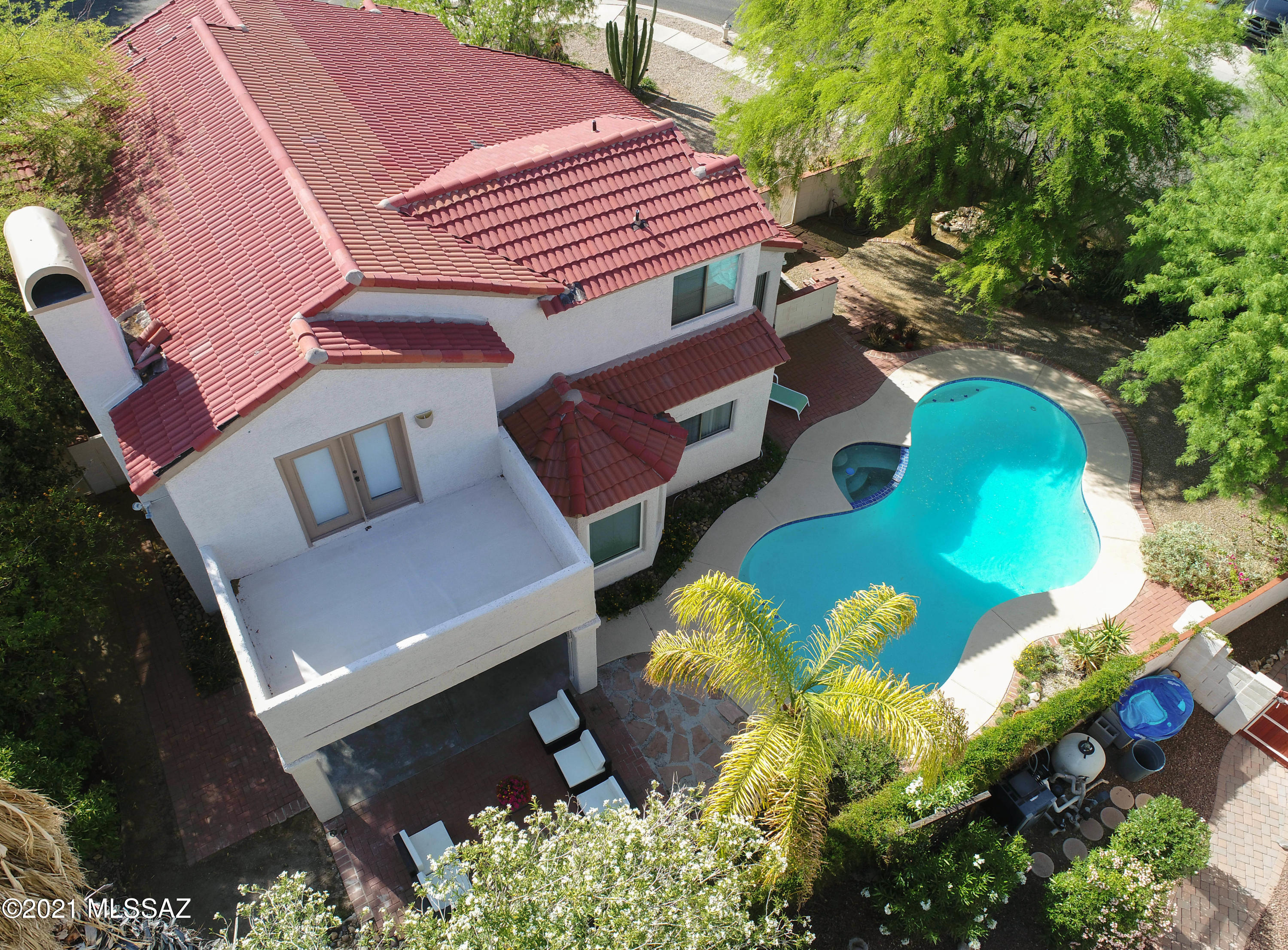 12560 North Wayfarer Way Oro Valley, AZ 85755 - Photo 16 of 43 an aerial view of a house with a yard and a garden