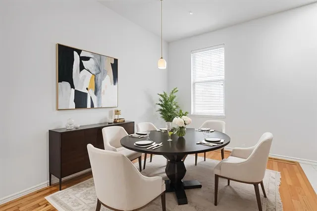 a dining room with furniture and window