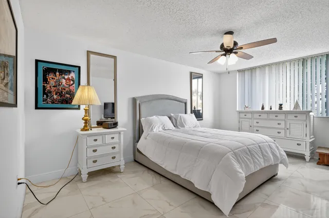 a bedroom with a bed and a cabinets