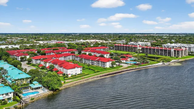 an aerial view of house with yard swimming pool and outdoor seating