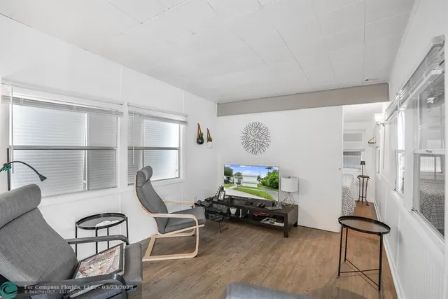 a room with furniture and a wooden floor