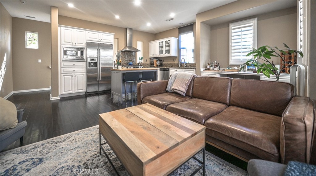64 Scarlet Bloom Irvine, CA 92618 - Photo 11 of 22 a living room with furniture and a large window