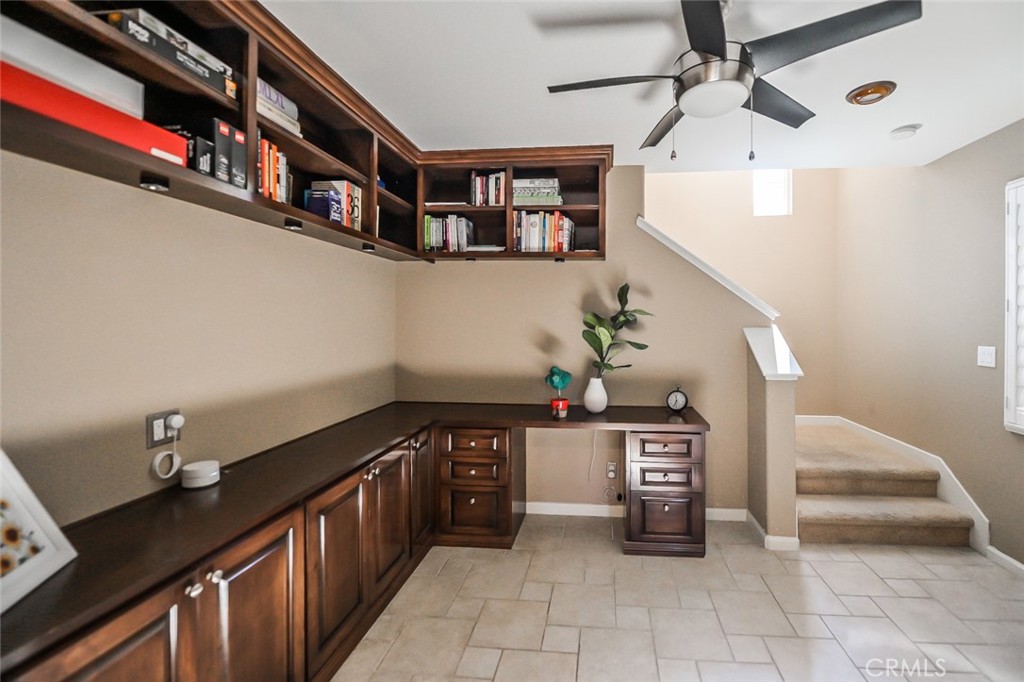 64 Scarlet Bloom Irvine, CA 92618 - Photo 12 of 22 a hallway with furniture and a potted plant