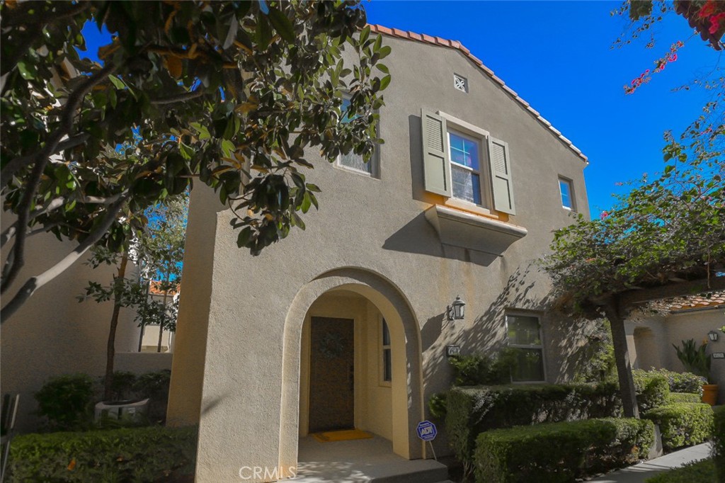 64 Scarlet Bloom Irvine, CA 92618 - Photo 3 of 22 a front view of a house with balcony