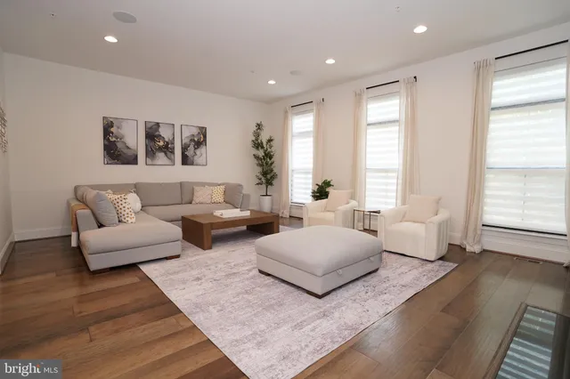 a kitchen with a refrigerator an oven and cabinets
