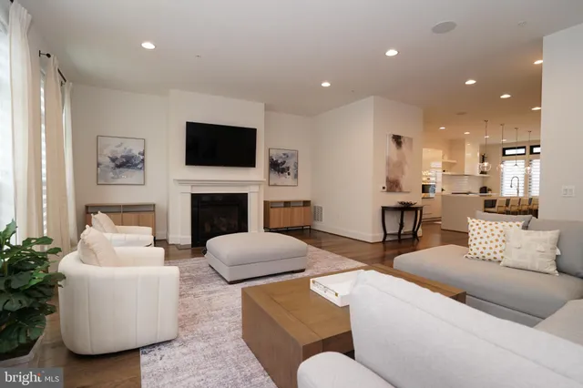 a kitchen with kitchen island granite countertop a table and chairs in it