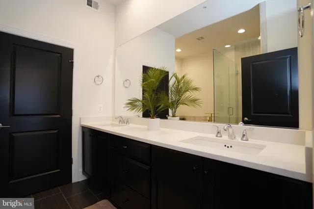 a living room with furniture and large windows