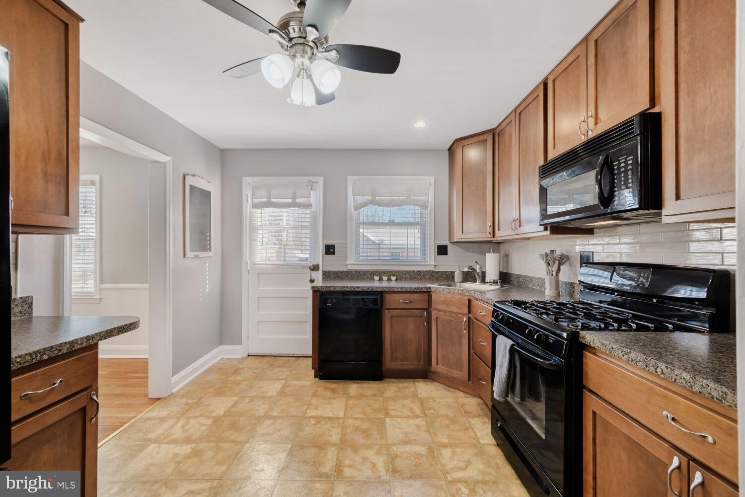 8127 Glen Gary Road Towson, MD 21286 - Photo 12 of 34 Modern kitchen with warm wood accents.