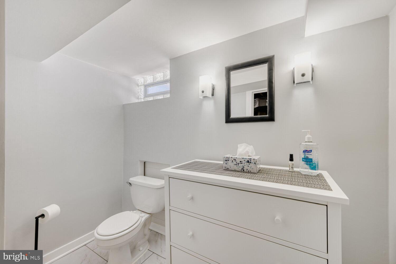 8127 Glen Gary Road Towson, MD 21286 - Photo 24 of 34 Sleek, modern bathroom with bright accents.