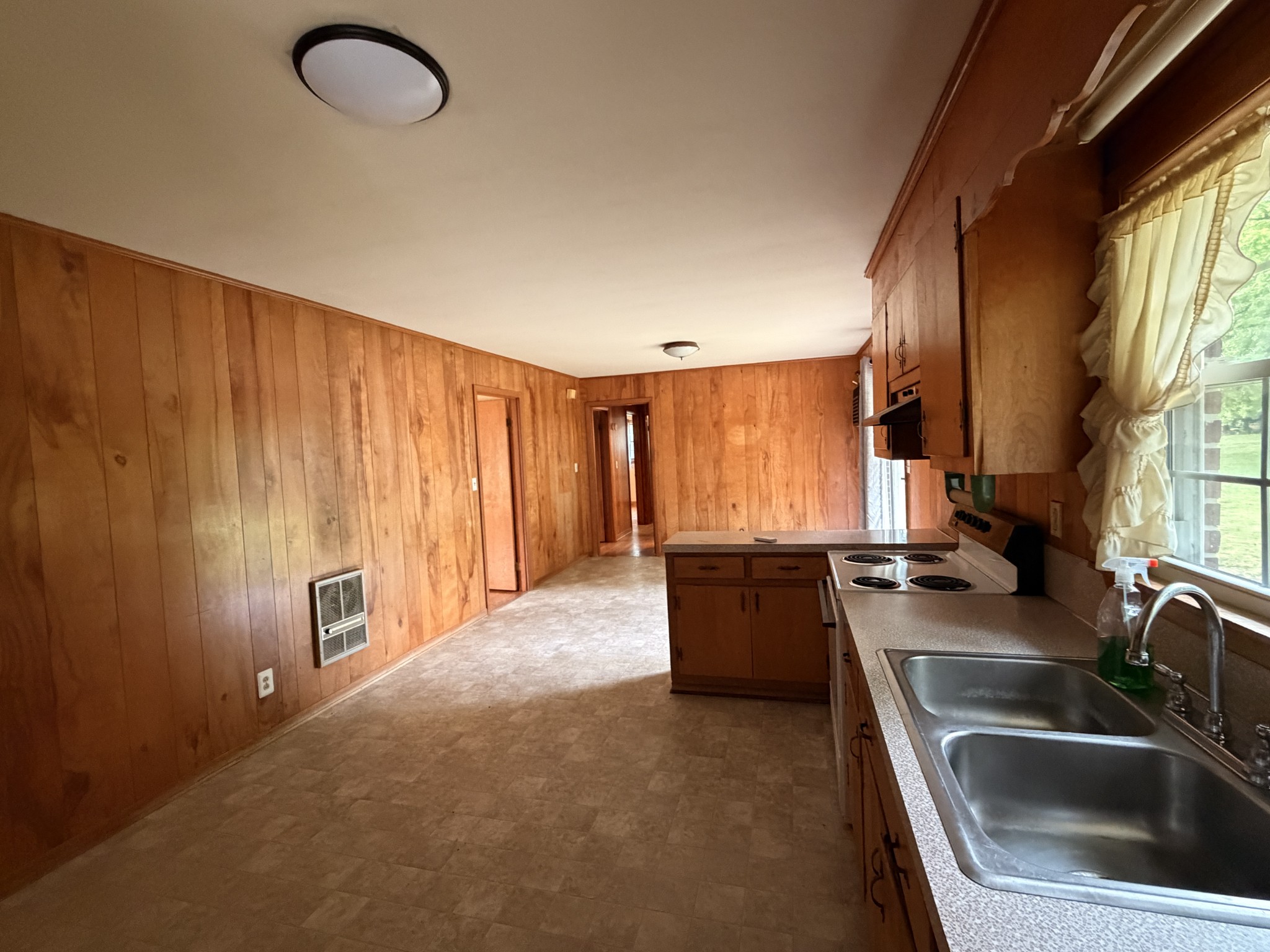 955 Rocky Road Pulaski, TN 38478 - Photo 9 of 10 a kitchen with sink refrigerator and window
