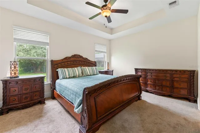 a front view of a house with a garden and yard