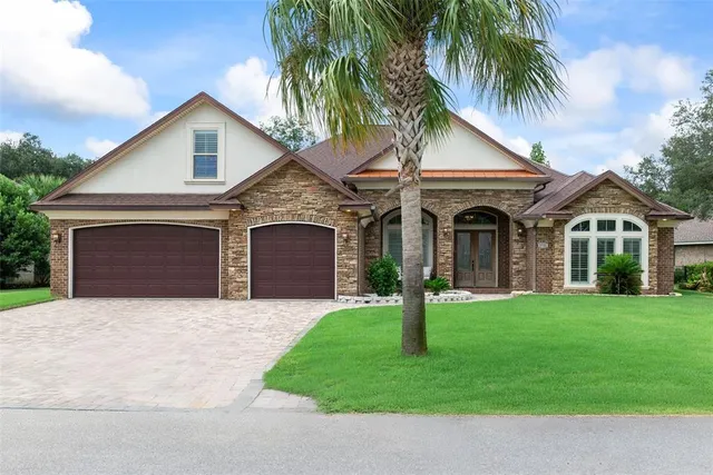 a bathroom with a tub sink double vanity granite tub shower and mirror