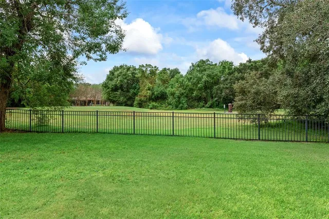a bedroom with furniture a couch and a baby crib