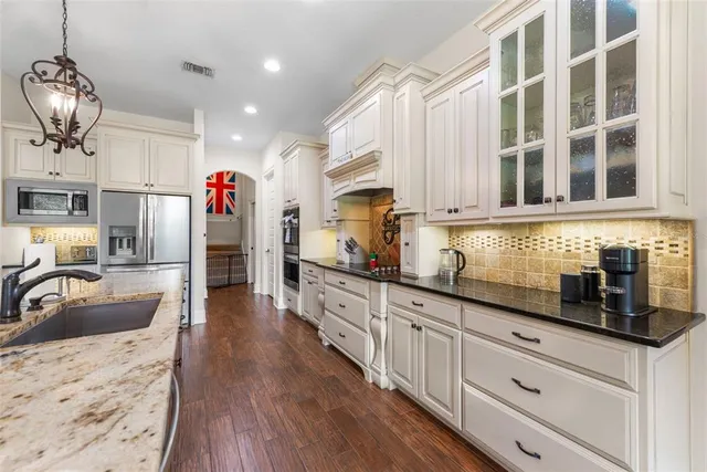 a spacious bedroom with a bed and a ceiling fan