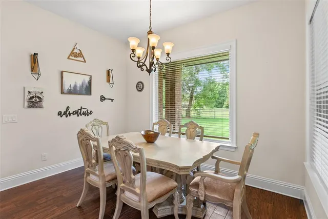 a spacious bathroom with a granite countertop sink and a mirror