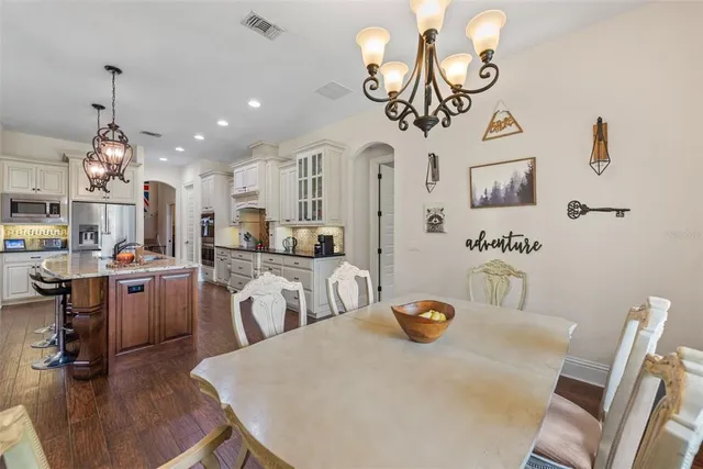 a spacious bathroom with a granite countertop sink and a large mirror