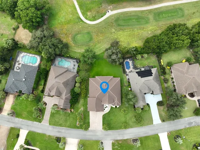 a living room with furniture flat screen tv and a large window