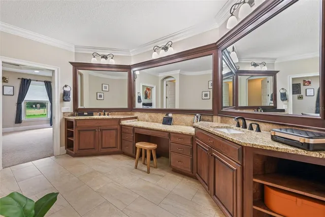a living room with furniture a flat screen tv and a window
