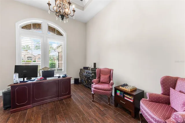 a swimming pool with outdoor seating and yard