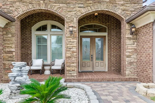 a blue bench sitting in front of a building