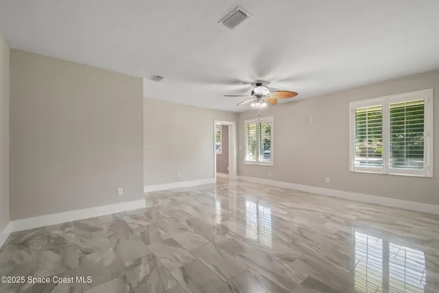 a view of an empty room and window