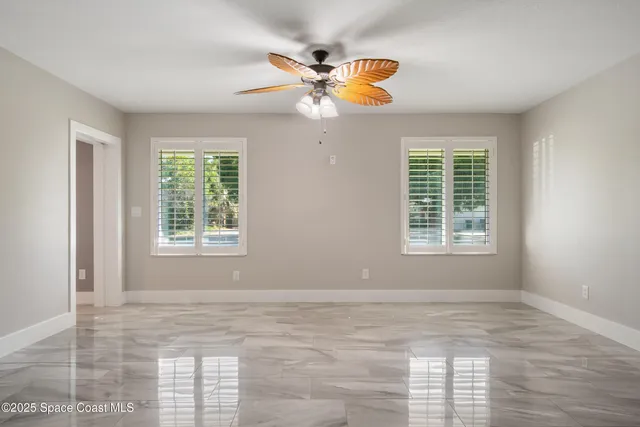 a view of an empty room and window