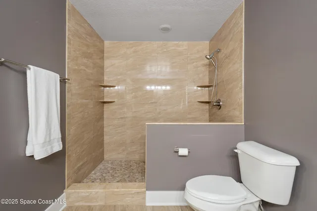a kitchen with stainless steel appliances a sink a counter space and a window