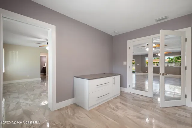 a view of a living room and floor to ceiling window