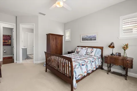 a bedroom with a bed and a table in it