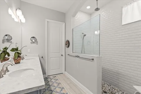 a bathroom with a sink and shower