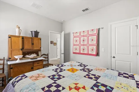 a bedroom that has a bed and a table in it
