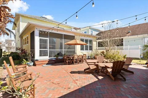 a view of a patio with table and chairs and potted plants