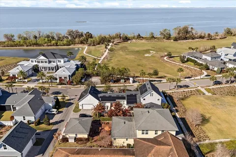 an aerial view of a building with ocean view