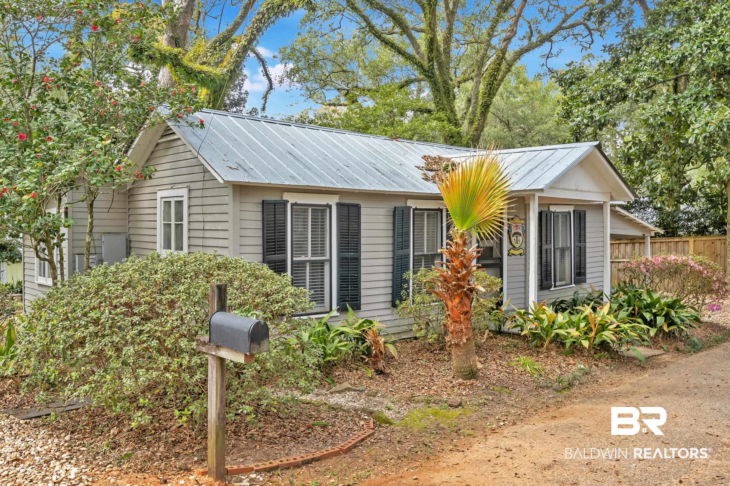 55 Boise Lane Fairhope, AL 36532 - Photo 15 of 24 View of front facade featuring metal roof and fence