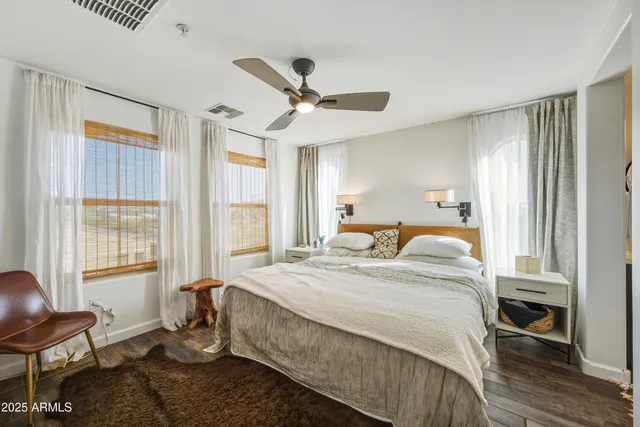 a bed room with a bed and a chair