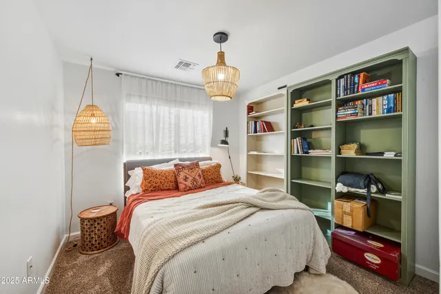 a bathroom with a toilet a sink and a mirror